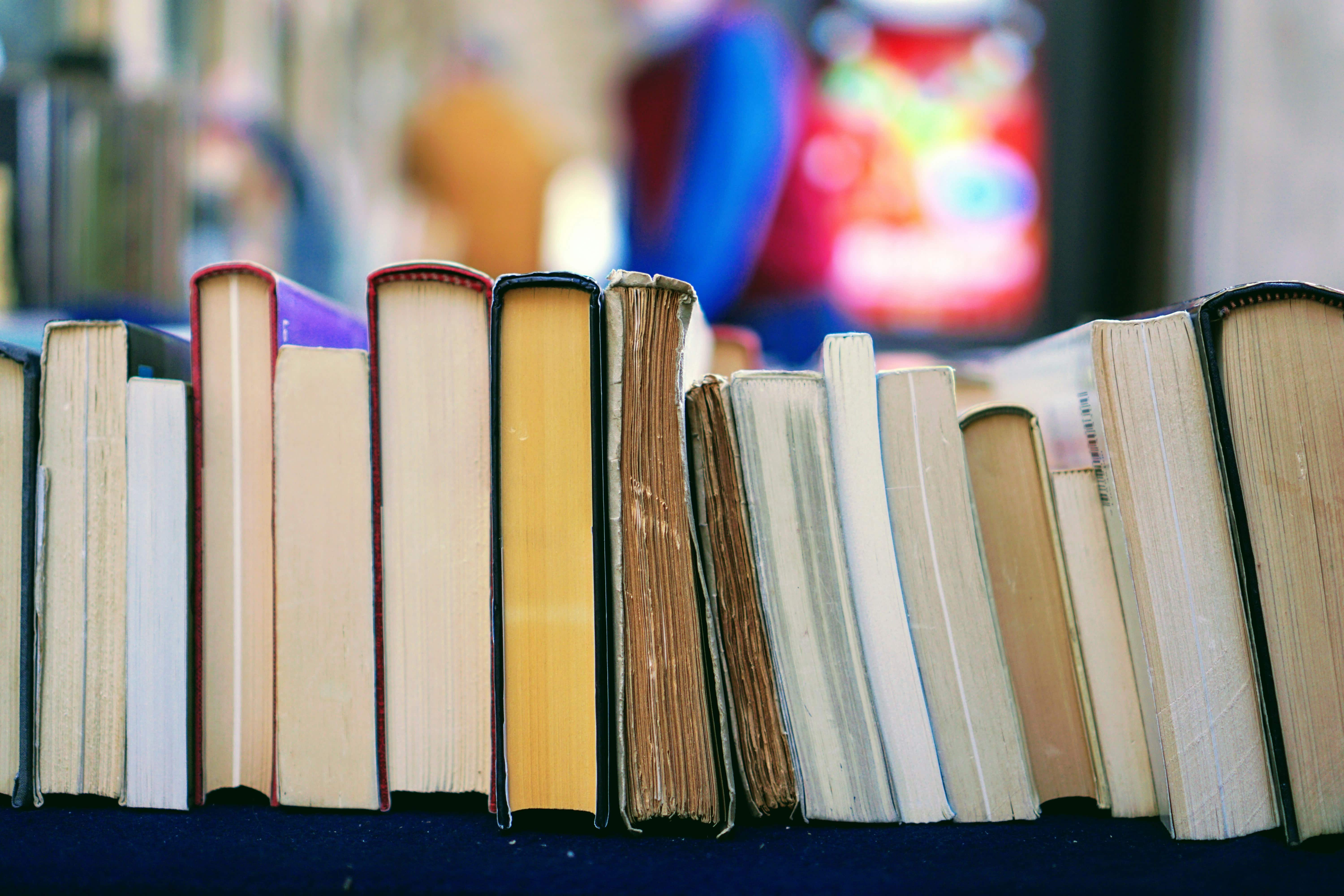 A row of old books on a table