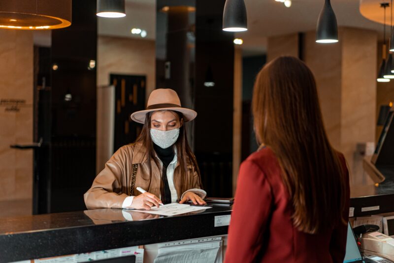 woman-check-in-at-hotel-front-desk-reception