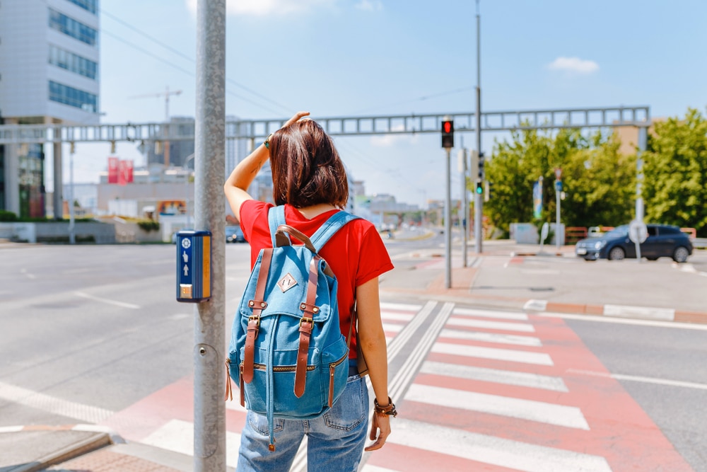 woman standing in front of traffic lights