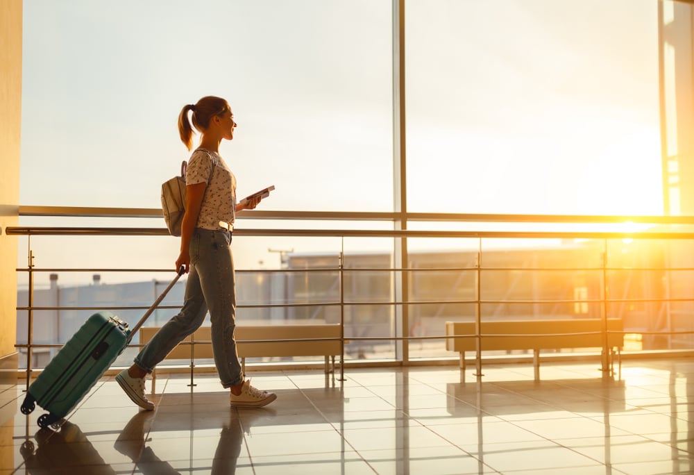 young woman walking in airport