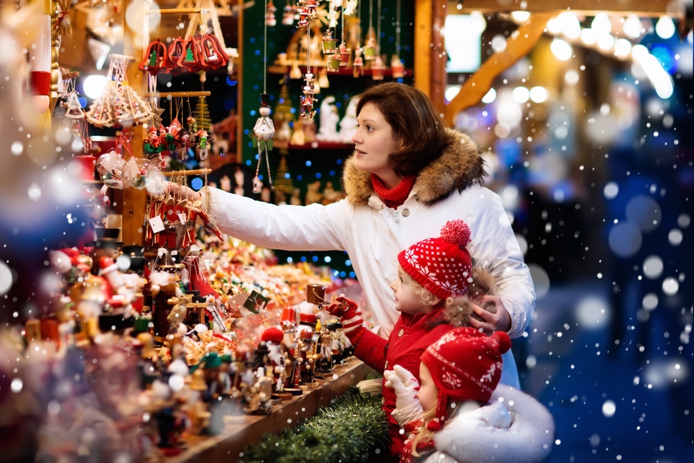 mom and daughter doing christmas shopping in germany