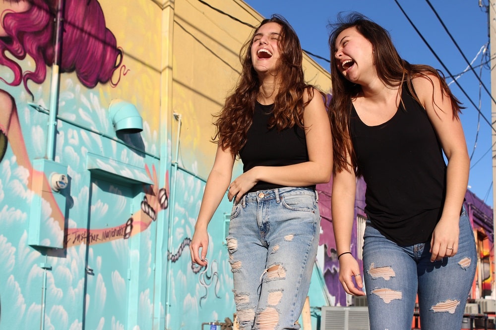 Two young women laughing