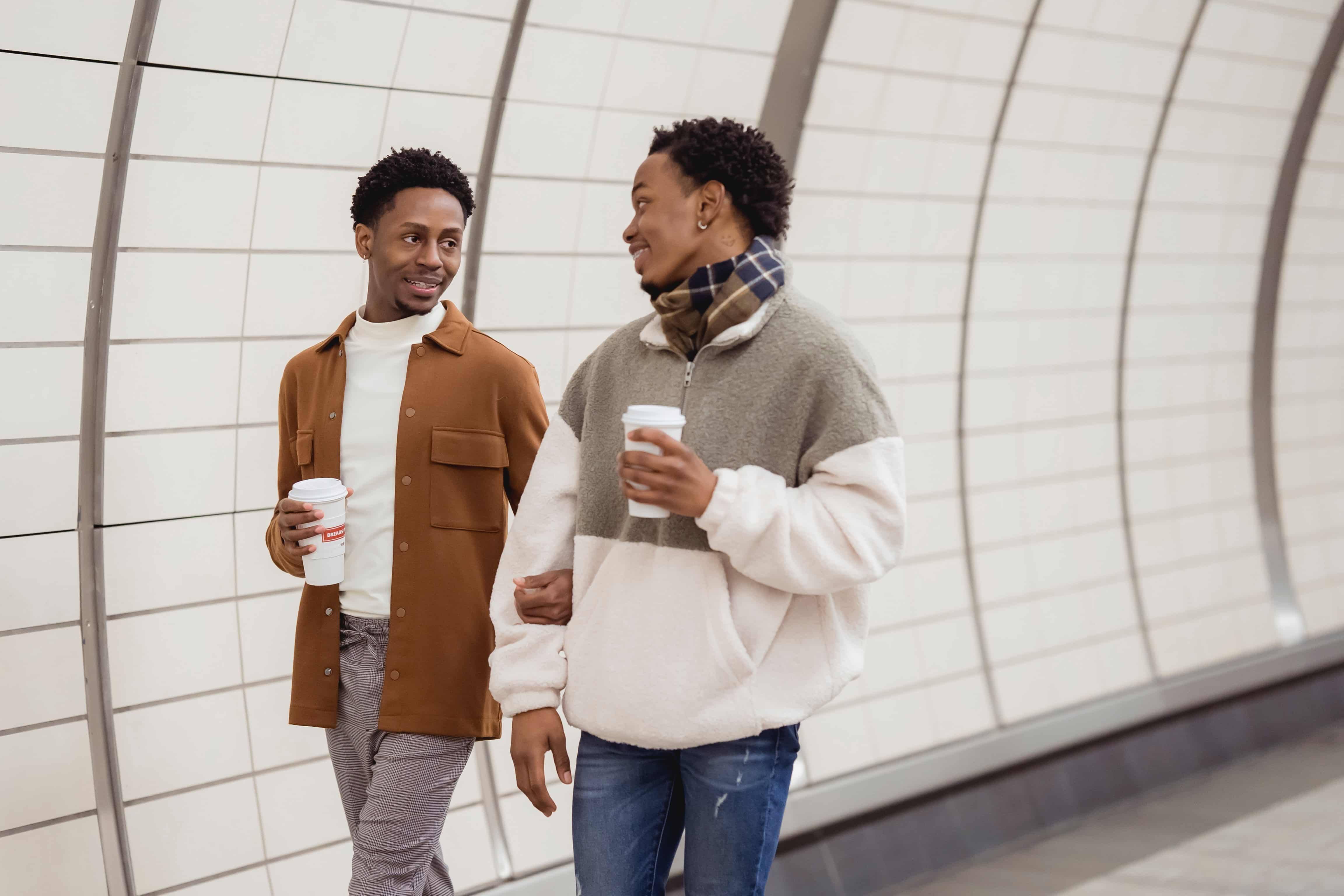 couple-walking-with-coffees