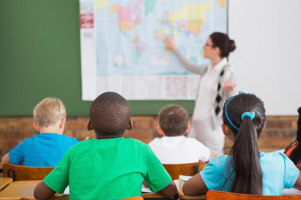 teacher-and-young-students-in-geography-class