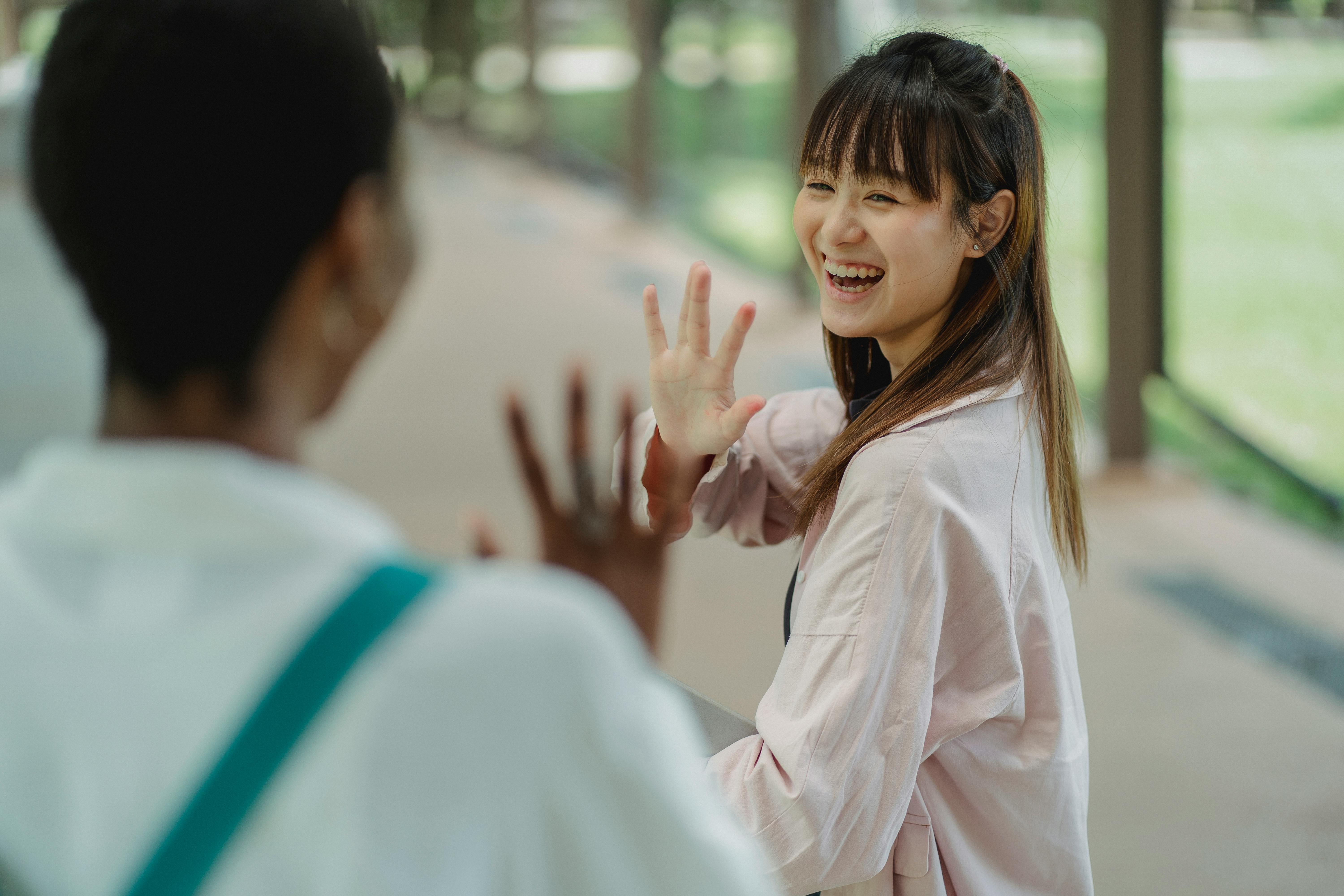 A woman waves goodbye to her boss