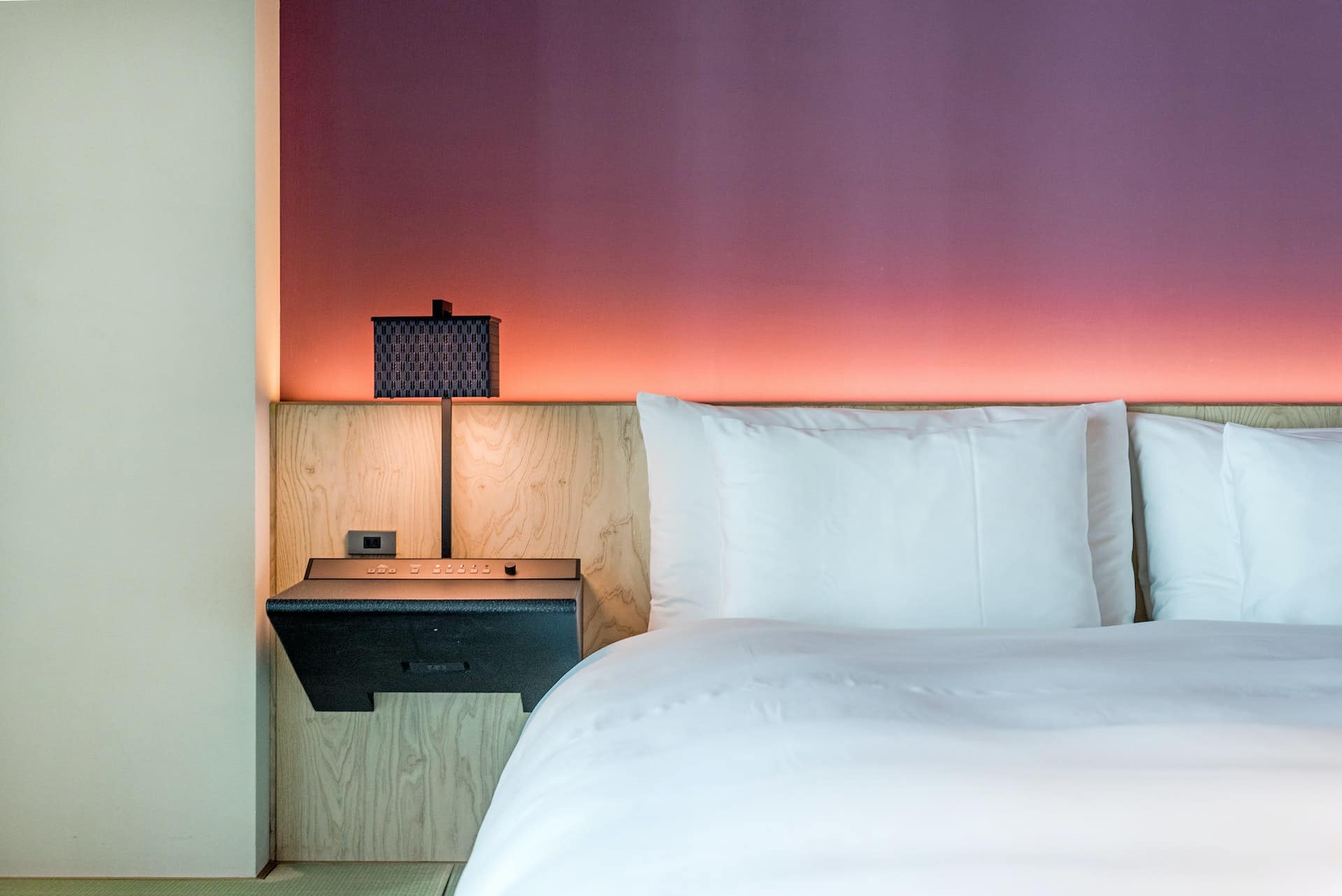 white-bed-and-pillows-in-hotel-room