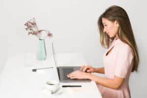 woman working at laptop computer